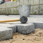 rubber-hammer-gray-pavement-sand-laying-paving-stones-city rubber-hammer-gray-pavement-sand-laying-paving-stones-city